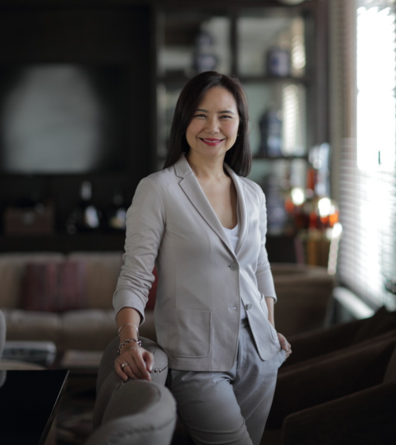 woman with a white blazer standing