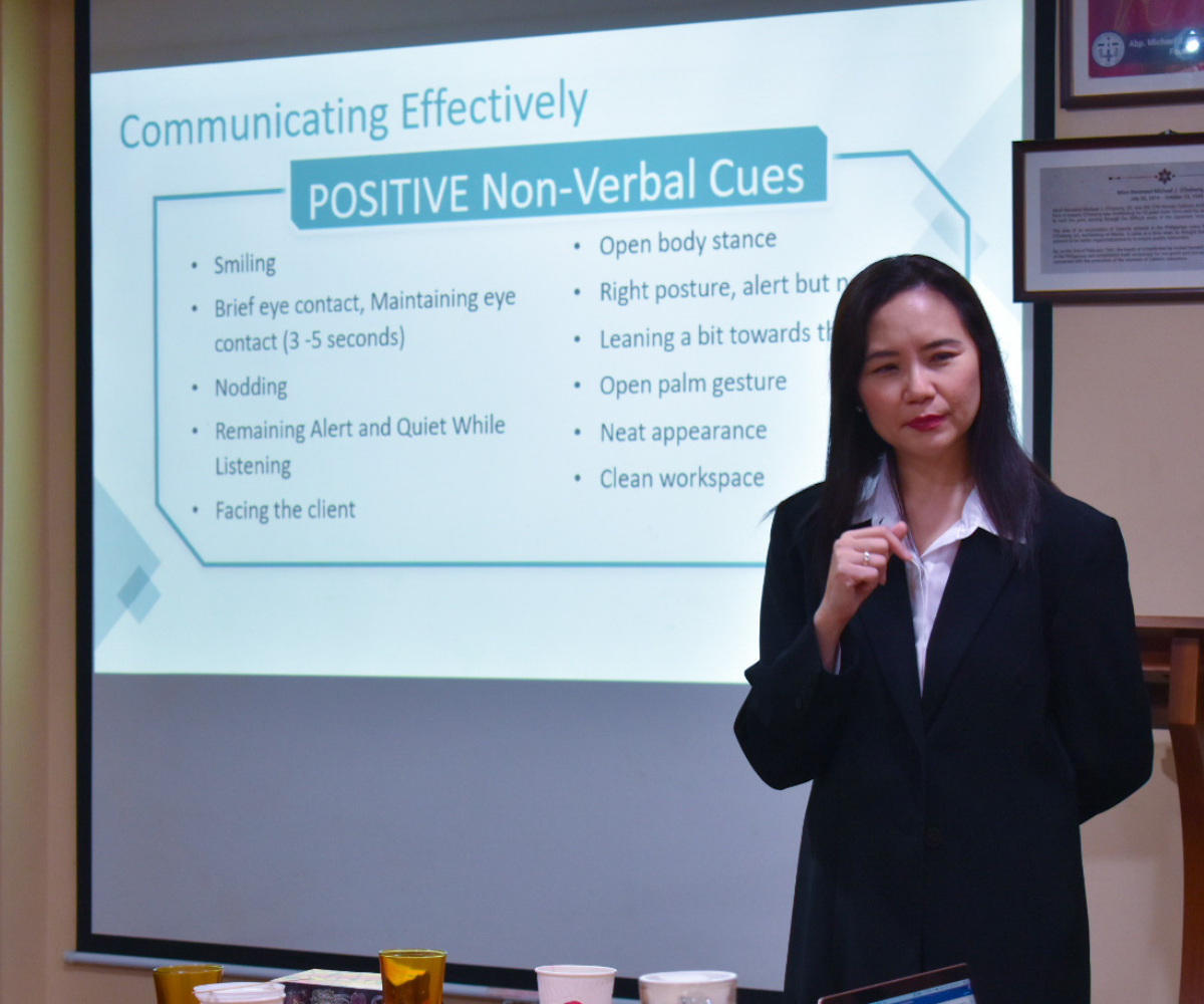 woman explaining a slide presentation