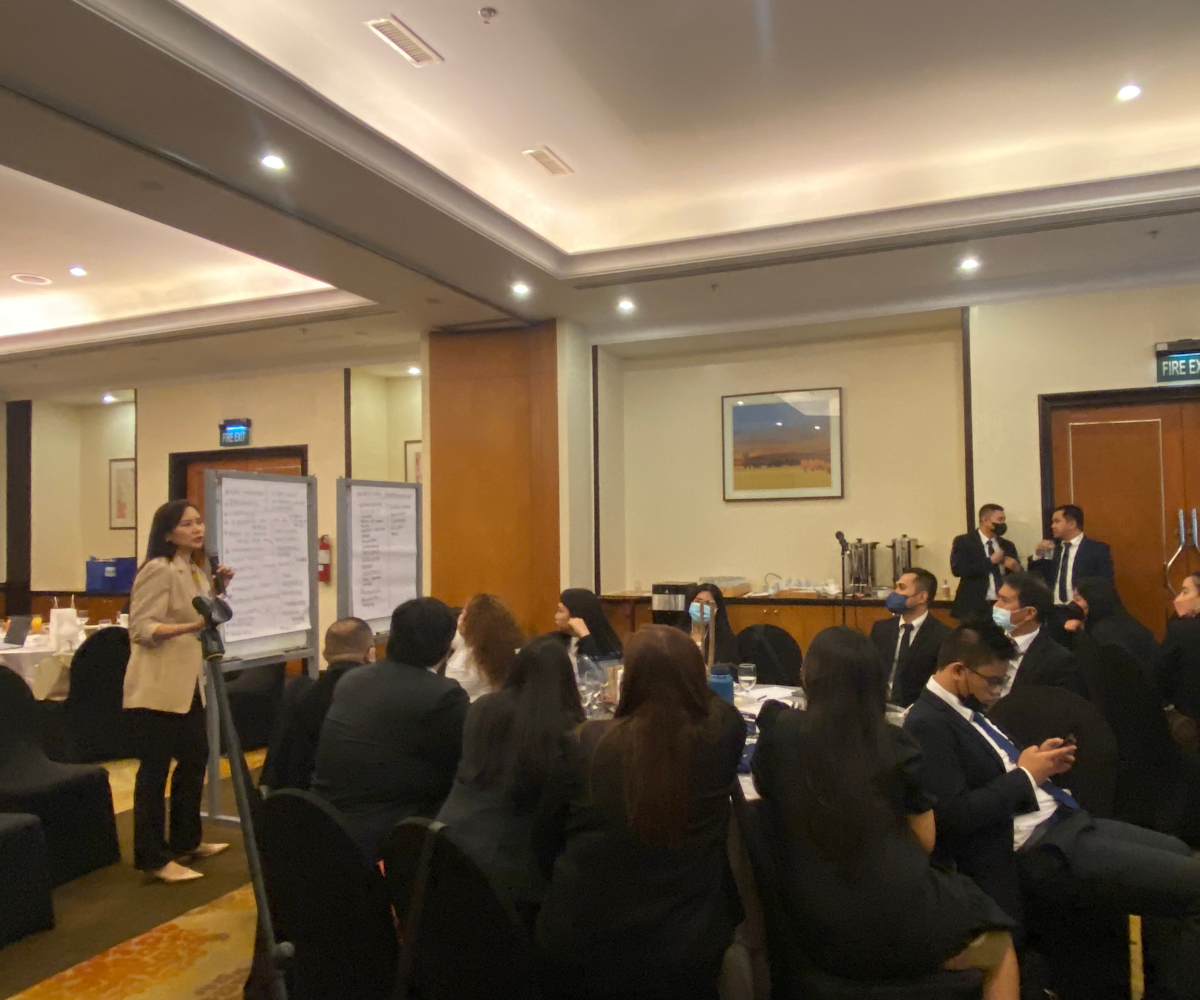 speaker lecturing a group of people